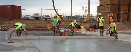 Daniel Kennedy's crew use a vibrating beam screed for precision finishes.